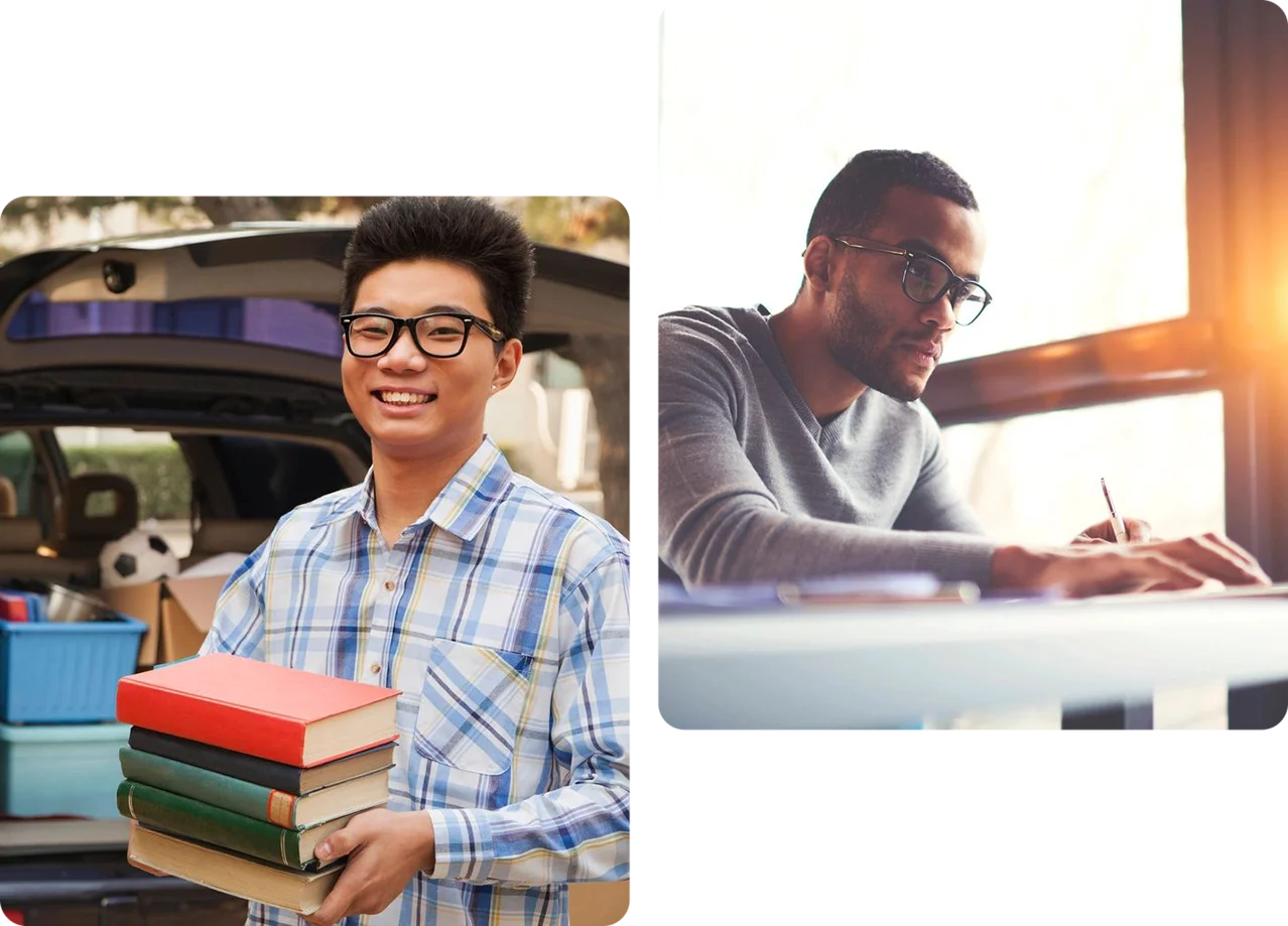 Two men are holding books and smiling.